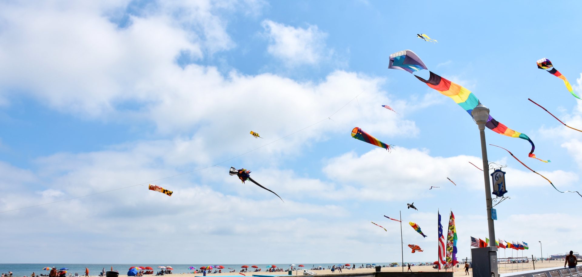 Kite Loft kites flying on Ocean City beach boardwalk.